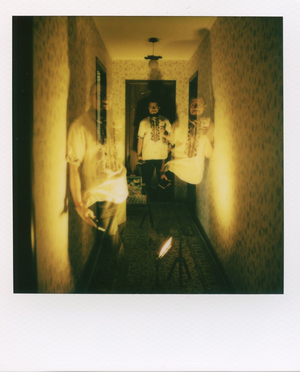 Polaroid self portrait in a hallway