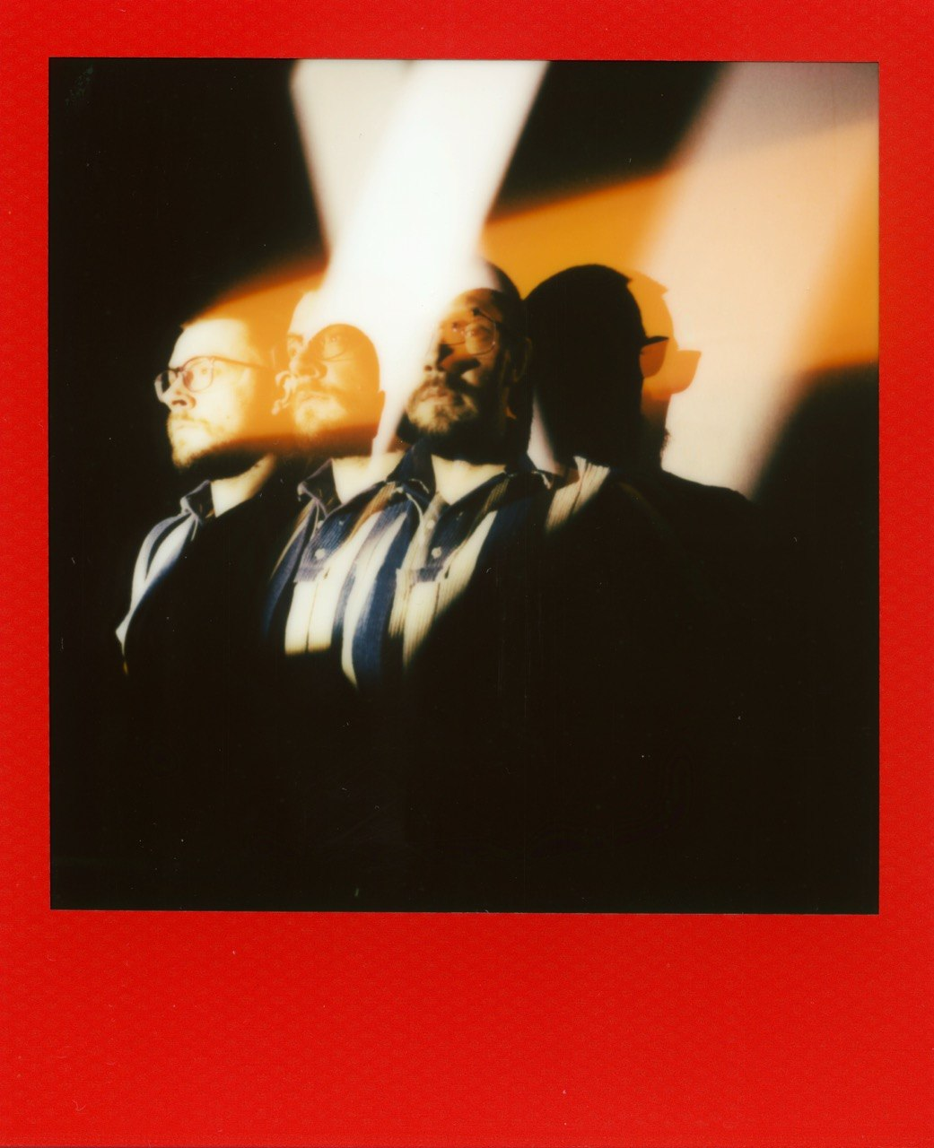 Multiple exposure self portrait on red polaroid film