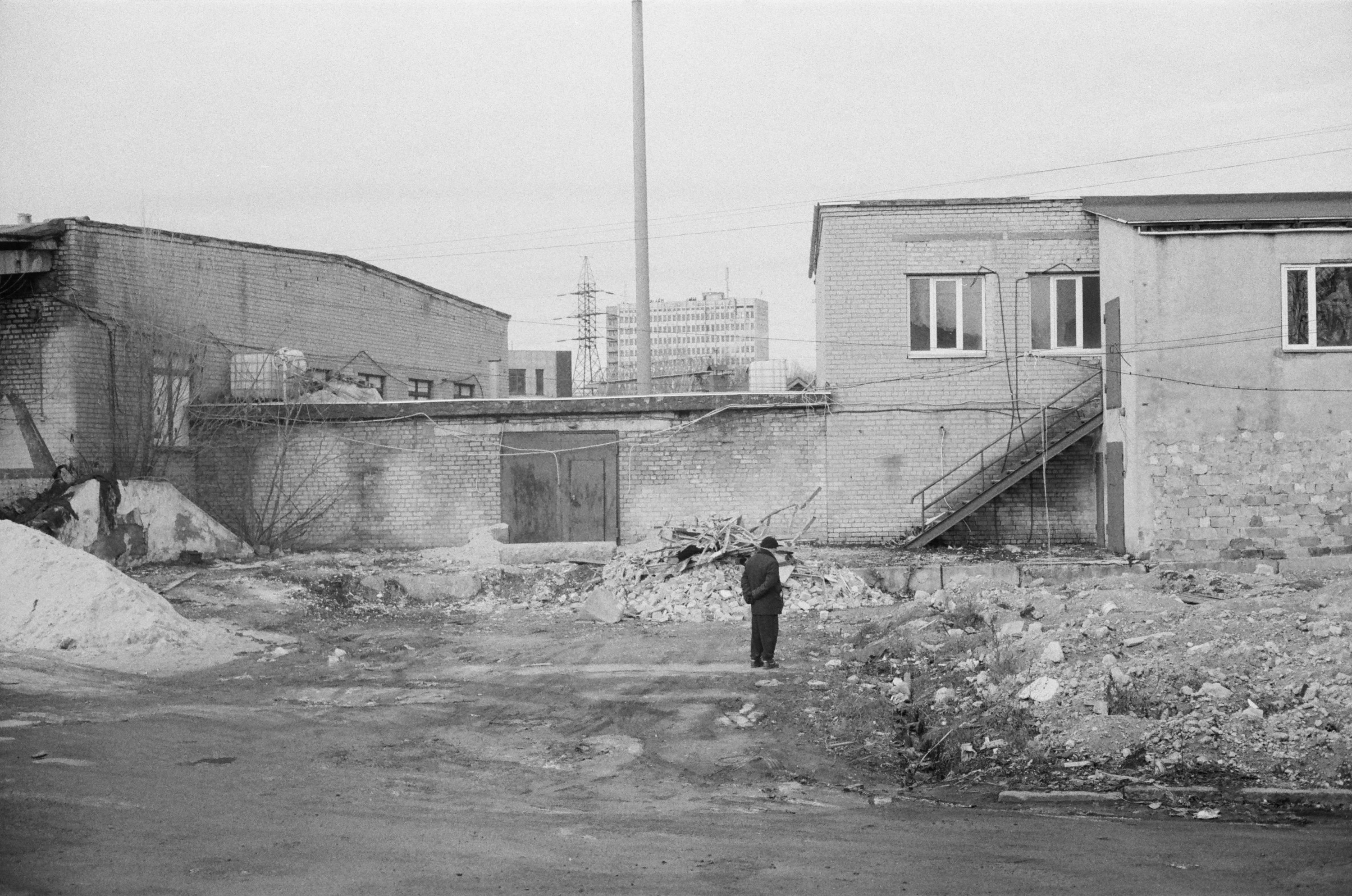 Industrial yard with a solitary figure