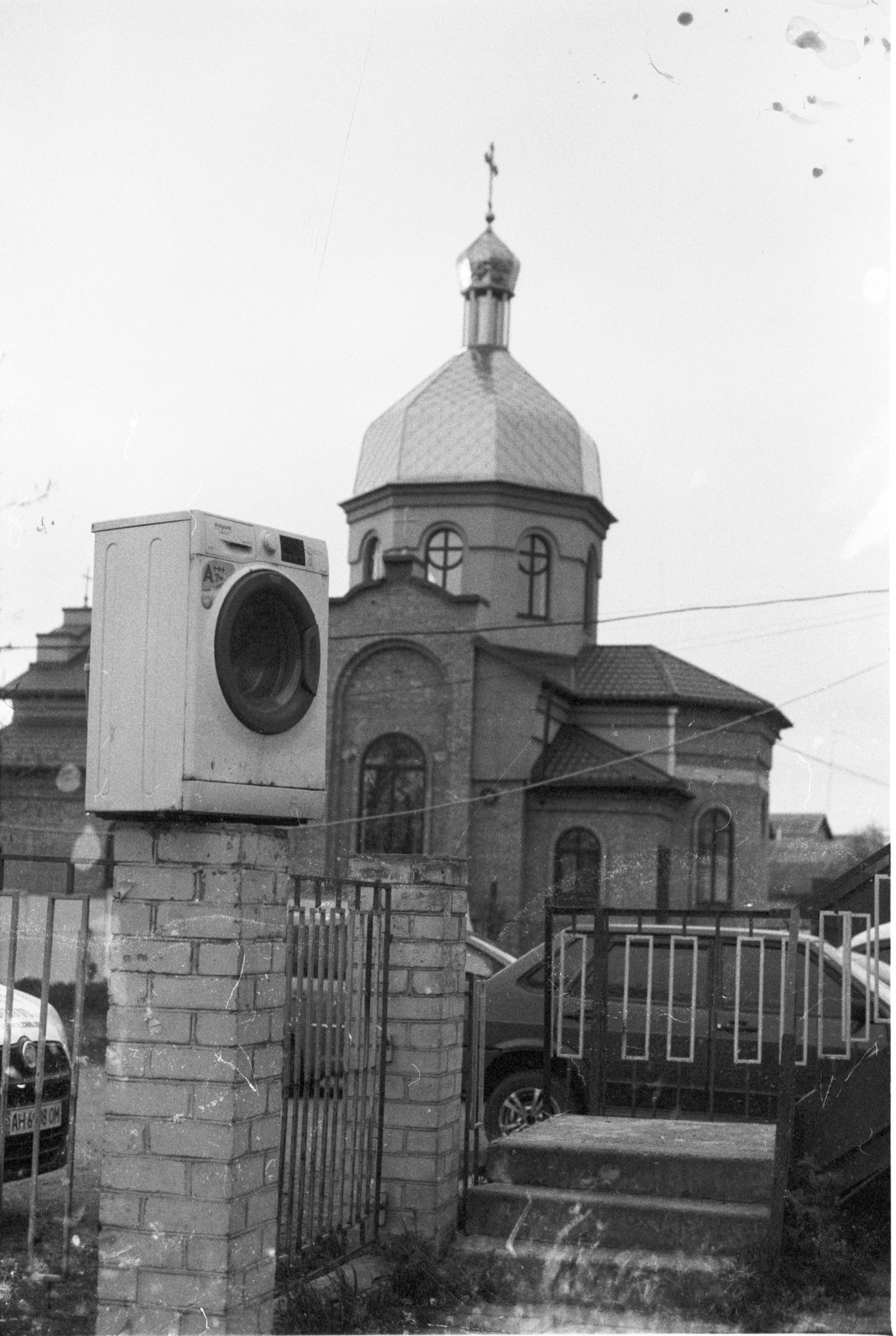 A washing machine in front of a church