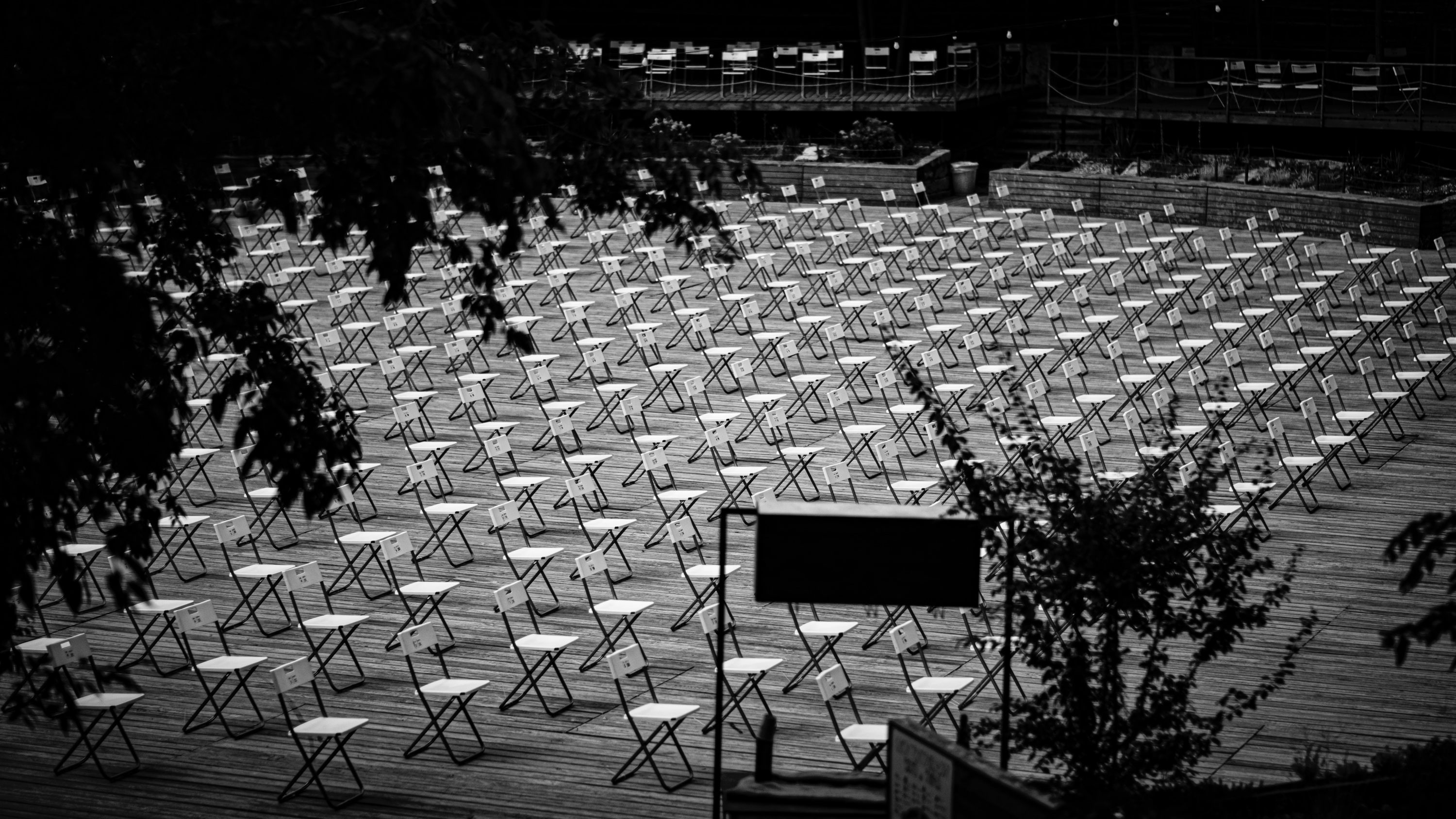 Empty chairs arranged in rows